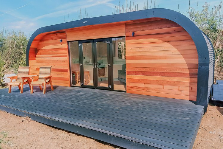 A pod, showing the wood exterior and decking area